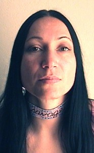 Contemporary Amerindian artist & designer Jude Norris wearing savage choker